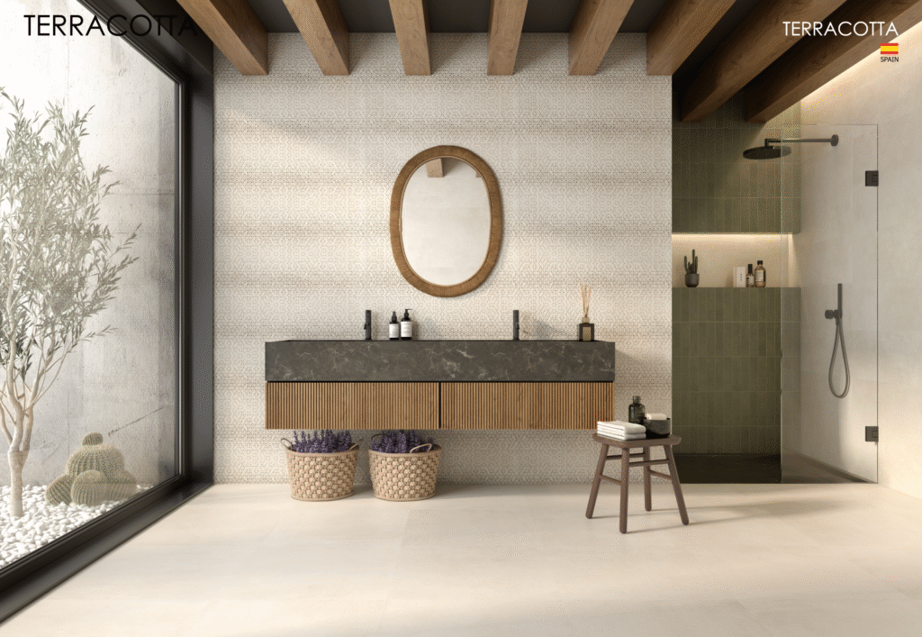 Luxury bathroom interior with customised tiles on shower walls and patterned feature wall behind vanity mirror.