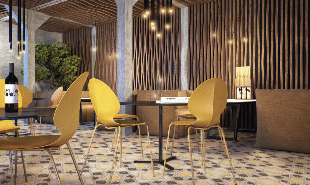 Stylish restaurant setting with yellow chairs and geometric tile colour combinations adding a bold, modern look.