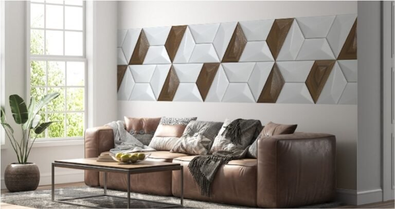 Modern living room with decorative luxury wall tiles featuring 3D geometric design in white and brown, complementing a neutral sofa and sunlight-filled interior in Gurgaon.