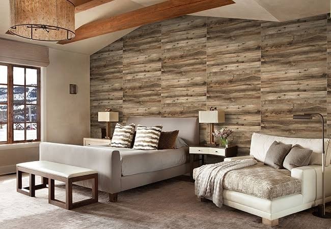 Elegant master bedroom with premium interior wall tiles in a warm wood texture, creating a cozy and sophisticated accent wall behind the bed.