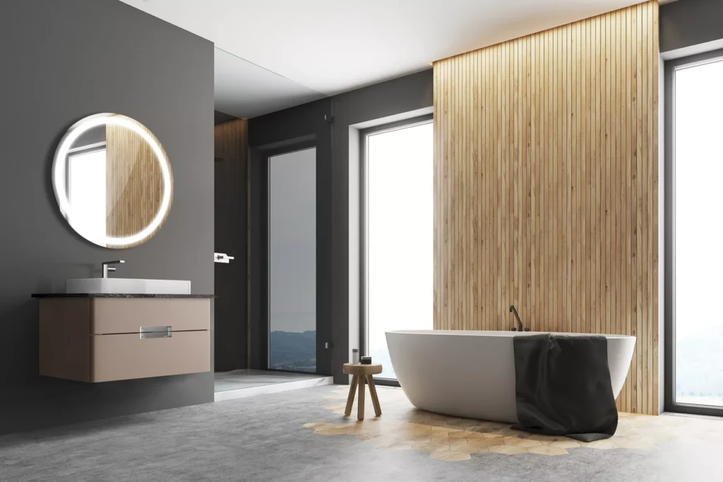 Minimalist bathroom design with freestanding bathtub, wall mounted vanity and luxury sanitaryware set against warm wooden wall panels