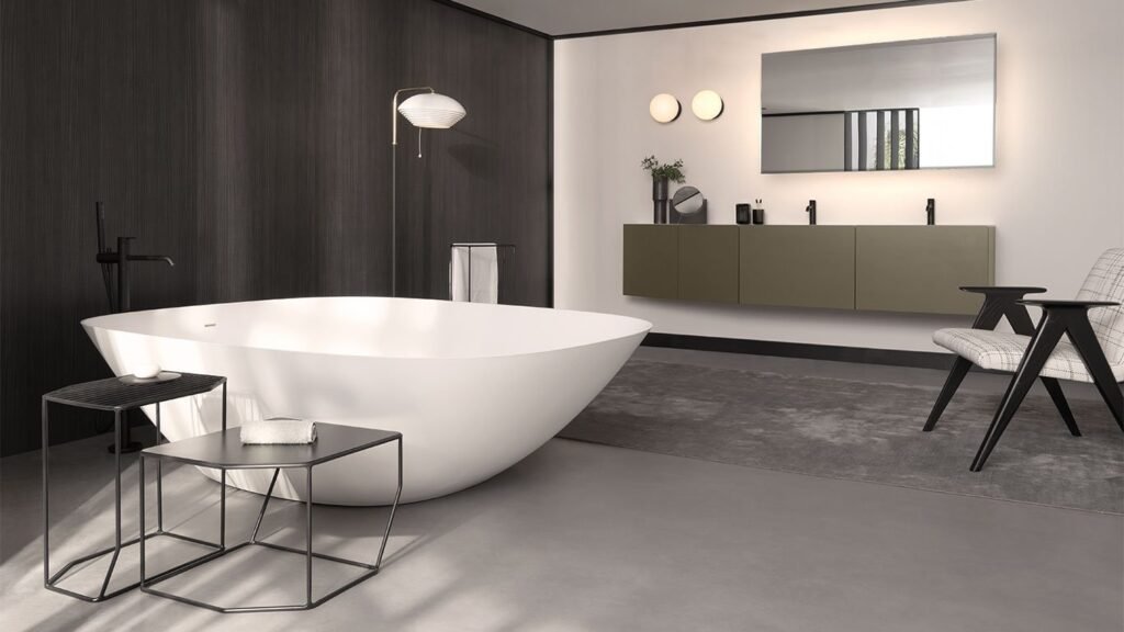 Minimalist spa-like bathroom featuring elegant freestanding bathtub and premium sanitaryware fittings