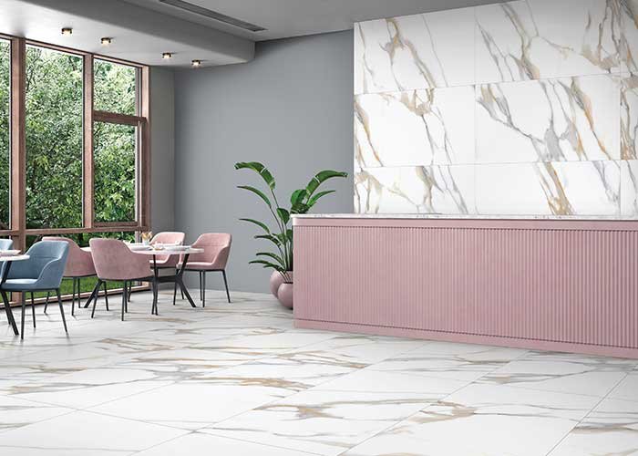 Premium marble-look flooring and wall backdrop illustrating sophisticated Ceramic Tile Design Ideas for upscale interiors with soft pastel furniture and contemporary design elements.